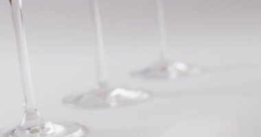 Diverse types of wines in glasses on white surface with copy space. Wine, alcohol, beverage and wine tasting concept.