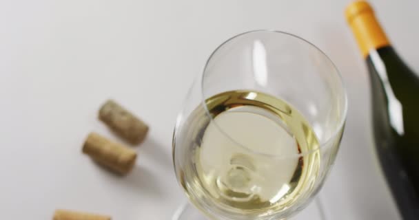 White Wine Bottle Glasses Cork Lying White Surface Copy Space — Wideo stockowe