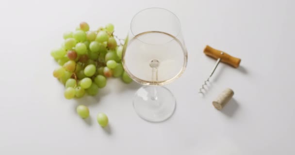White Wine Glass Corkscrew Grapes Lying White Surface Copy Space — Vídeos de Stock