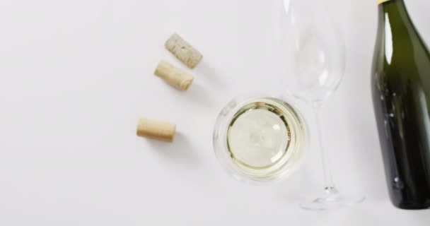 White Wine Bottle Glasses Cork Lying White Surface Copy Space — Vídeos de Stock
