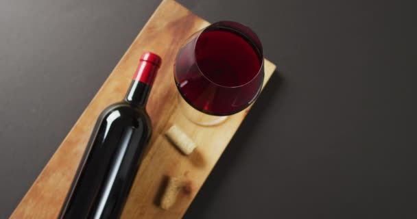 Red Wine Glass Bottle Cork Lying Wooden Board Copy Space — Vídeos de Stock