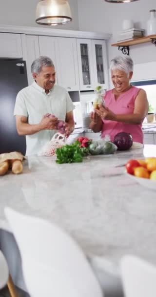 Vertical Video Happy Senior Biracial Couple Laughing Holding Vegetables Spending — Vídeo de Stock