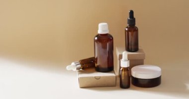 Close up of different beauty products on beige background with copy space. Beauty products, cosmetics and skincare concept.