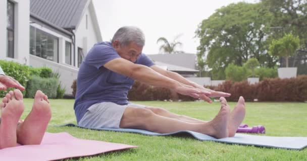 Happy Senior Diverse Couple Practicing Yoga Garden Spending Quality Time — Stockvideo