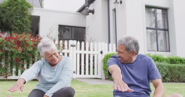 Happy Senior Diverse Couple Practicing Yoga Garden Spending Quality Time — Stockvideo