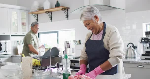 Happy Senior Biracial Couple Washing Dishes Kitchen Spending Quality Time — Stok video