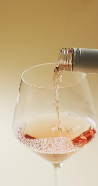 Vertical Video Rose Wine Pouring Bottle Large Wine Glass Alcohol — Vídeo de stock