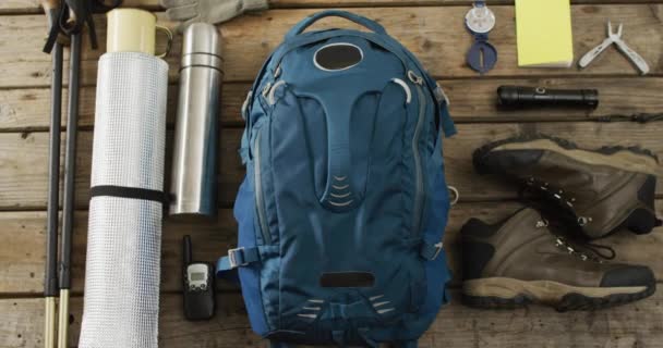 Camping Equipment Rucksack Boots Thermos Wooden Background National Camping Month — Stockvideo