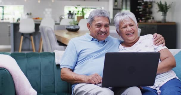 Happy Senior Biracial Couple Laughing Using Tablet Spending Quality Time — Stok video
