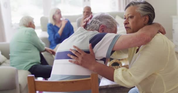 Senior Biracial Woman Comforting Sad Diverse Senior Male Friend Support — Vídeo de Stock