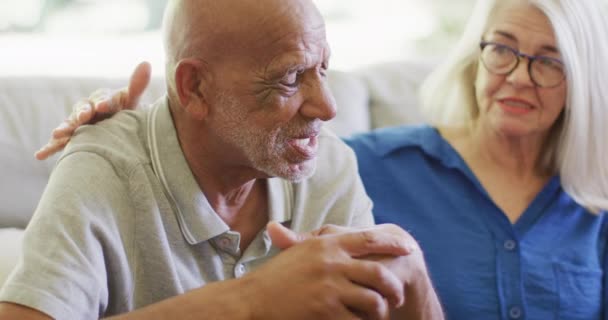 Senior Caucasian Woman Consoling Sad Diverse Senior Male Friend Living — Stock Video