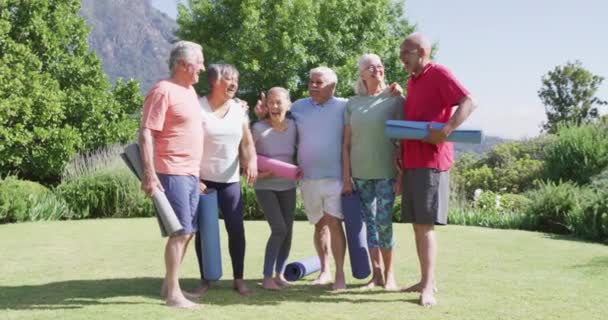 Diverse Group Happy Male Female Seniors Talking Exercising Sunny Garden — Stockvideo
