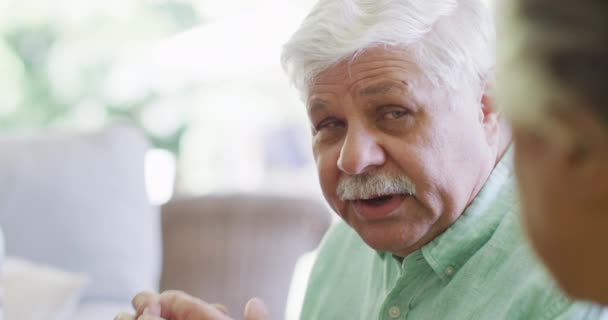 Senior Caucasian Man Talking Friend Living Room Slow Motion Friendship — стоковое видео