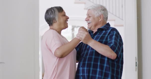 Happy Diverse Senior Couple Having Fun Dancing Together Home Slow — стоковое видео
