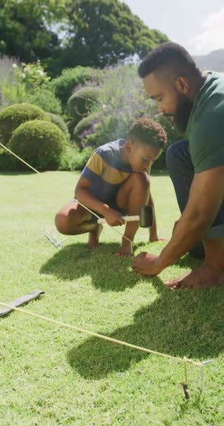 Vertical Video African American Father Son Pitching Tent Slow Motion — Stock Video