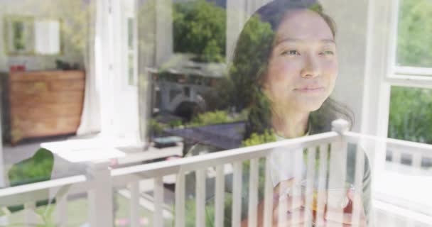 Happy Asian Woman Drinking Tea Looking Window Slow Motion Spending — Stock Video