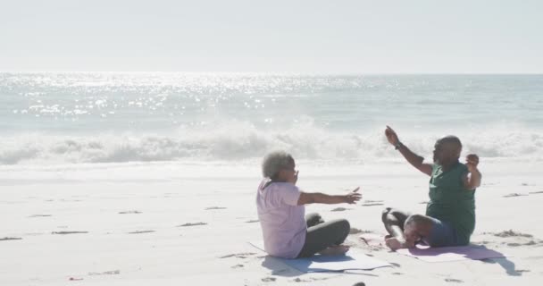 Happy Senior African American Couple Doing Yoga Meditating Beach Copy — Stock Video