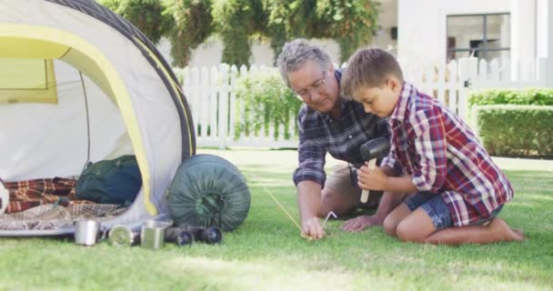 Happy Caucasian Grandfather Grandson Pitching Tent Together Garden Slow Motion — Stock Video