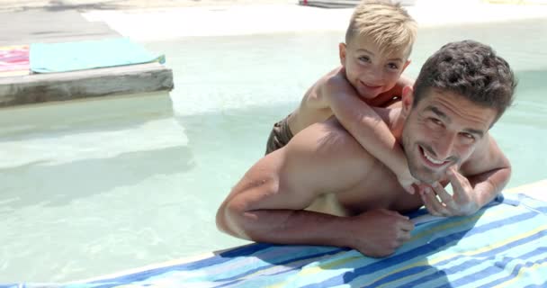 Portrait Happy Caucasian Father Carrying His Son Towel Swimming Pool — Stock Video
