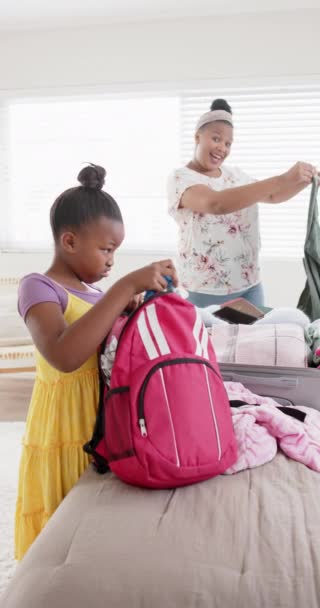Vertical Video Happy African American Mother Daughter Packing Luggage Slow — Stock Video