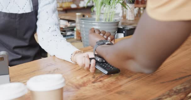 Midsection African American Man Paying Smartwatch Coffee Shop Slow Motion — Stock Video