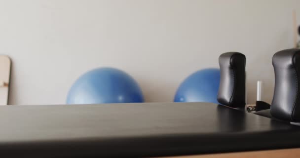 Close Empty Pilates Rehabilitation Room Reformer Exercise Balls Slow Motion — Stock Video