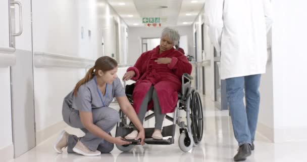 Happy Diverse Female Nurse Talking Senior Patient Wheelchair Slow Motion — Stock Video