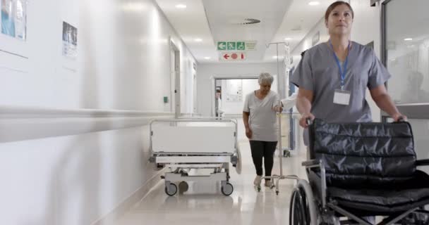 Serious Diverse Male Doctor Talking Senior Patient Drip Walking Slow — Stock Video