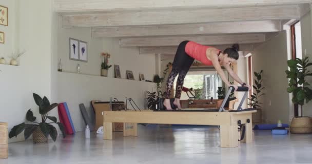 Fit Senior Caucasian Woman Stretching Reformer Pilates Studio Unaltered Slow — Stock Video