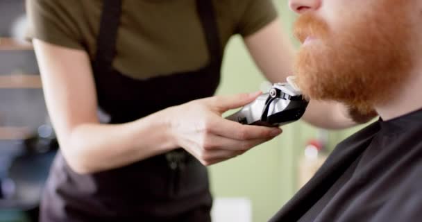 Midsection Caucasian Female Barber Trimming Beard Male Client Barbershop Slow — Stock Video