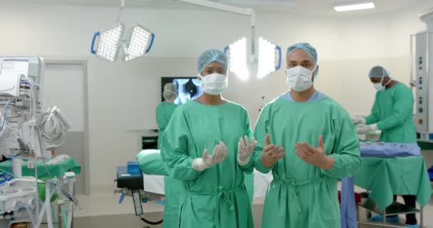Portrait Diverse Surgeons Wearing Surgical Gowns Operating Theatre Slow Motion — Stock Video