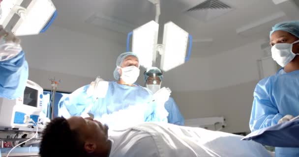 Diverse Surgeons Using Defibrillator Patient Operating Theatre Slow Motion Hospital — Stock Video