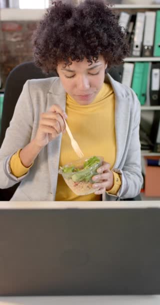 Vertical Video Focused Biracial Casual Businesswoman Using Laptop Having Lunch — Stock videók