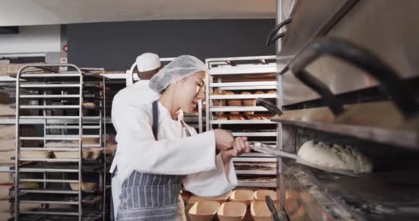 Diverse Bakers Working Bakery Kitchen Putting Bread Oven Slow Motion — Stock Video