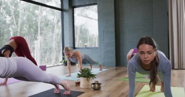 Multiracial Young Women Practicing Cobra Pose Yoga Mats Studio Unaltered — Stock Video