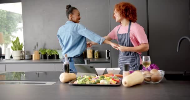 Happy Diverse Couple Aprons Having Fun Cooking Dancing Together Kitchen — Stock Video