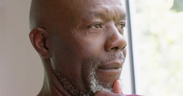 Thoughtful African American Senior Man Looking Out Window Home Slow — Stock Video