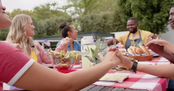 Diverse Group Friends Holding Hands Saying Prayer Dinner Table Garden — Stock Video