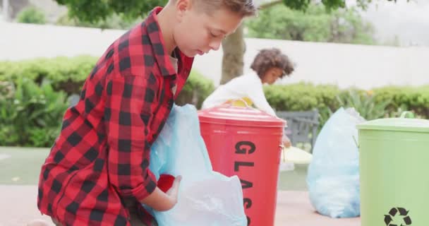 Video Caucasian Schoolboy Collecting Rubbish Recycling Schoolyard Copy Space Education — Stock Video