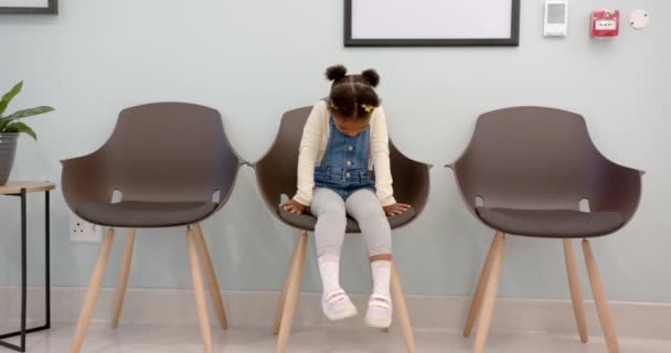 African American Girl Sitting Hospital Waiting Room Copy Space Slow — Stockvideo