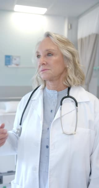 Vertical Video Portrait Caucasian Senior Female Doctor Smiling Hospital Medical — Stock Video
