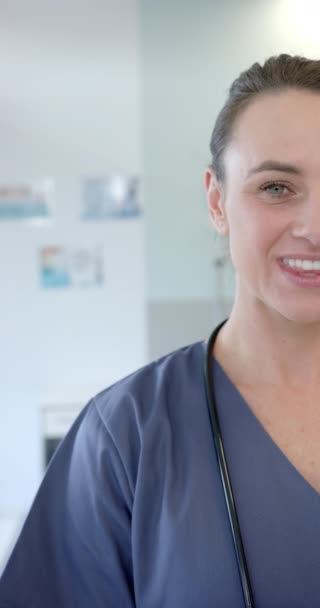 Vertical Video Portrait Caucasian Female Health Worker Smiling Hospital Medical — 图库视频影像