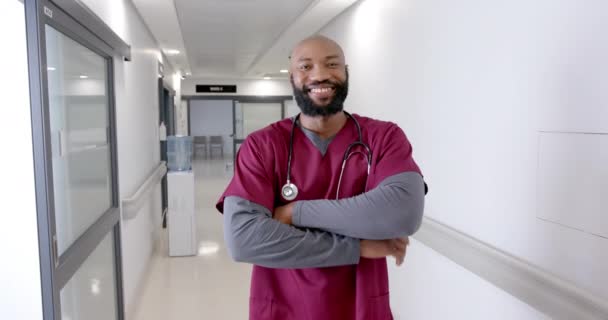 Portrait Happy African American Male Doctor Hospital Corridor Slow Motion — Stockvideo