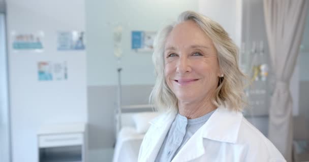 Portrait Happy Senior Caucasian Female Doctor Hospital Room Slow Motion — Stockvideo