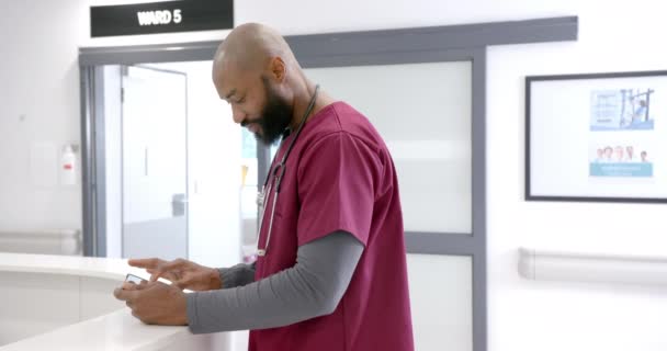 Portrait Happy African American Male Doctor Using Tablet Hospital Reception — Stockvideo