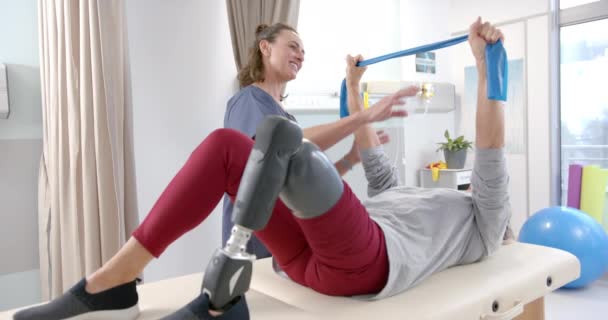 Caucasian Female Physiotherapist Female Senior Patient Prosthetic Leg Exercising Prosthetics — стоковое видео