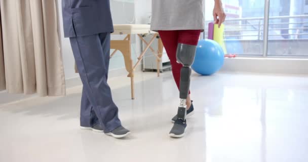 Caucasian Female Physiotherapist Female Senior Patient Prosthetic Leg Exercising Prosthetics — Stock video