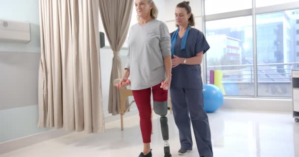 Caucasian Female Physiotherapist Female Senior Patient Prosthetic Leg Exercising Prosthetics — Vídeos de Stock