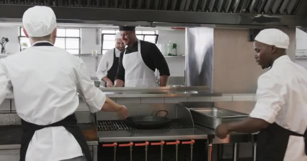 Focused Diverse Male Chef Instructing Trainee Male Chefs Kitchen Slow — Stock Video