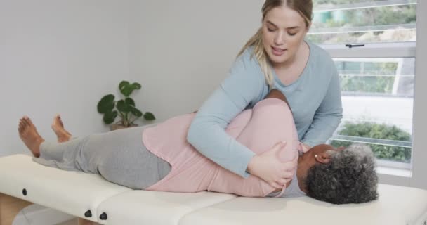 Caucasian Female Physiotherapist Massaging Senior Woman Copy Space Slow Motion — Stock Video